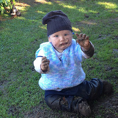 child-playing-in-muddy-puddle-at-everest-learning